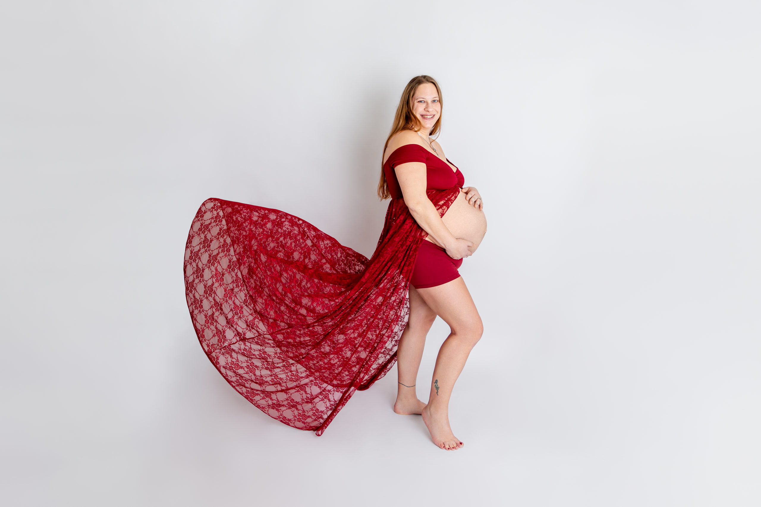 Studio Maternity Image with flowing Red dress